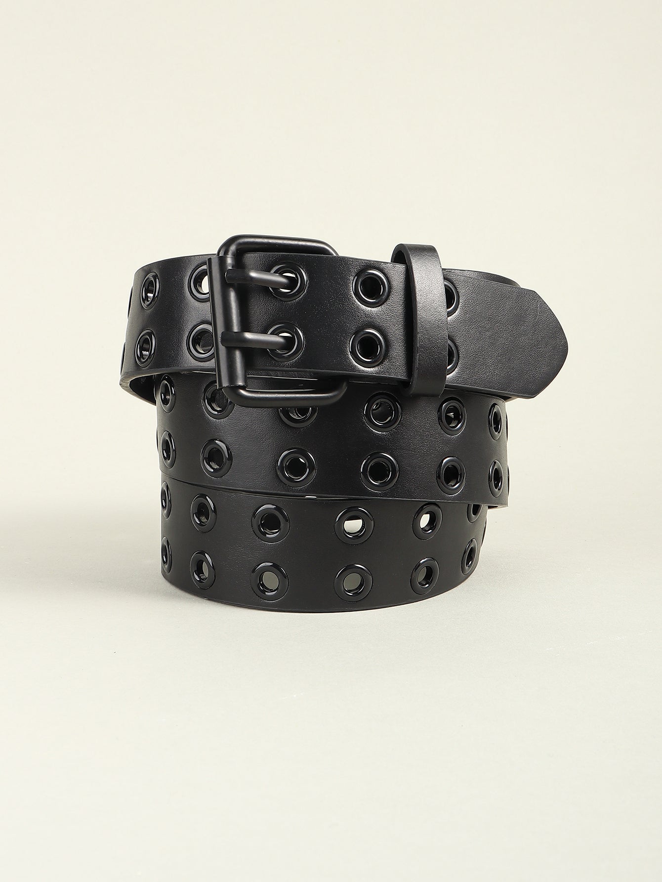 Black belt with metal grommets and square buckle, front close-up view.