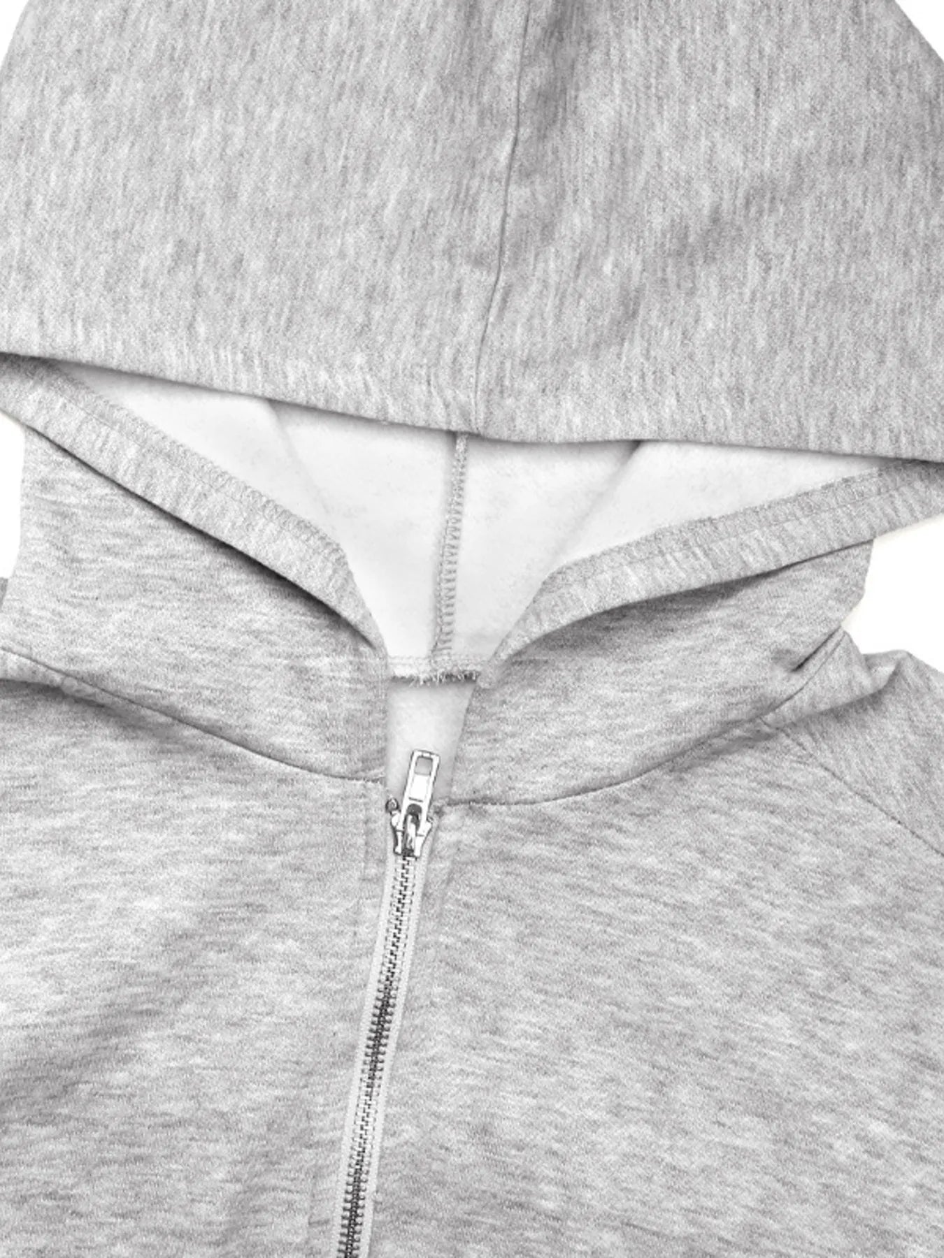 Light gray hoodie close-up showing hood and front zipper pull