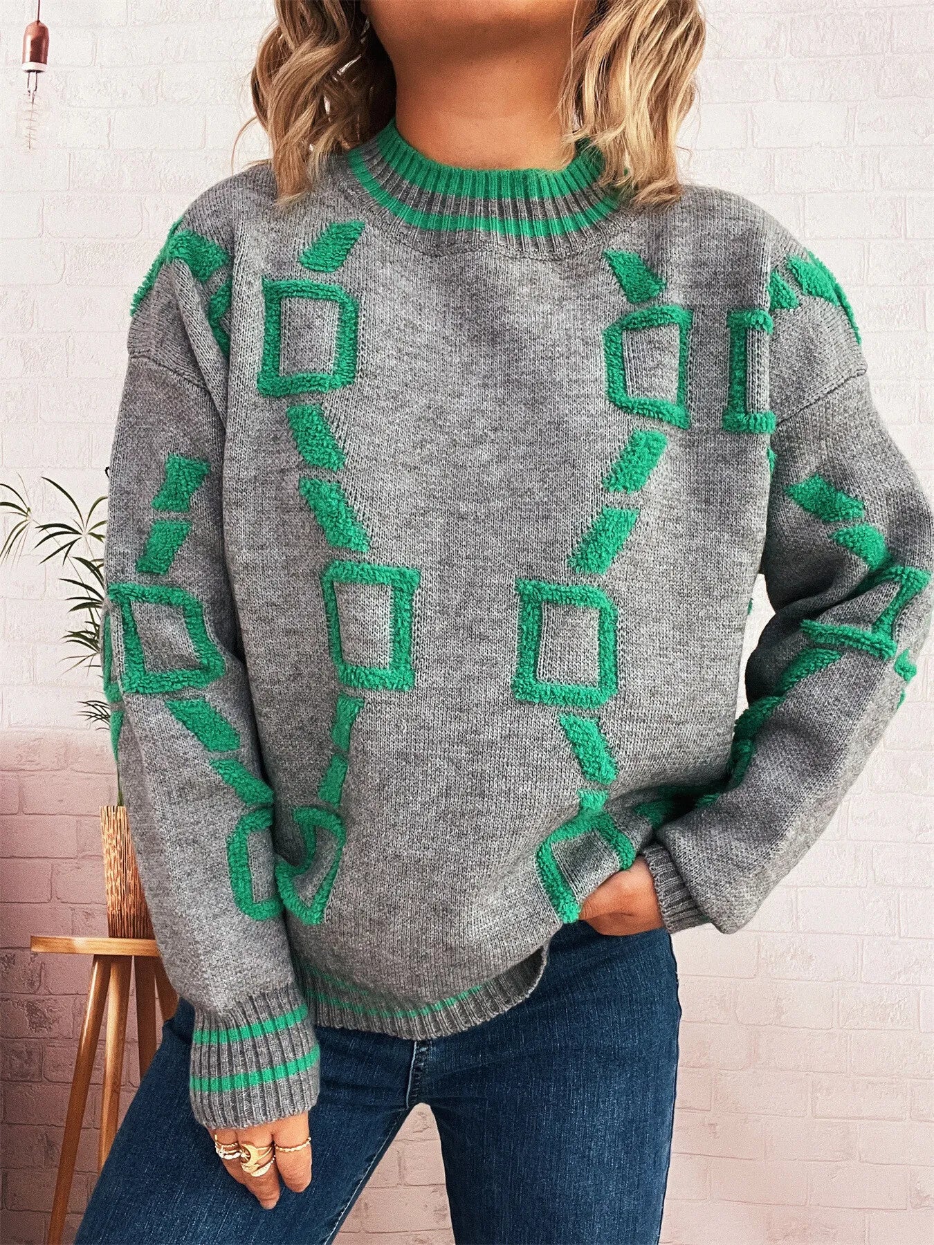 Heather gray round-neck long-sleeve sweater with green geometric pattern and ribbed collar