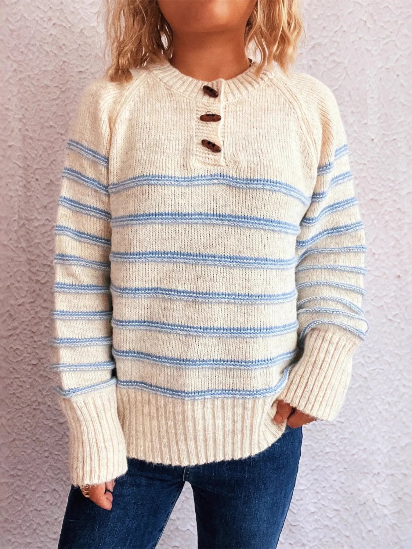 Cream striped knit long sleeve sweater with short button placket and ribbed hem