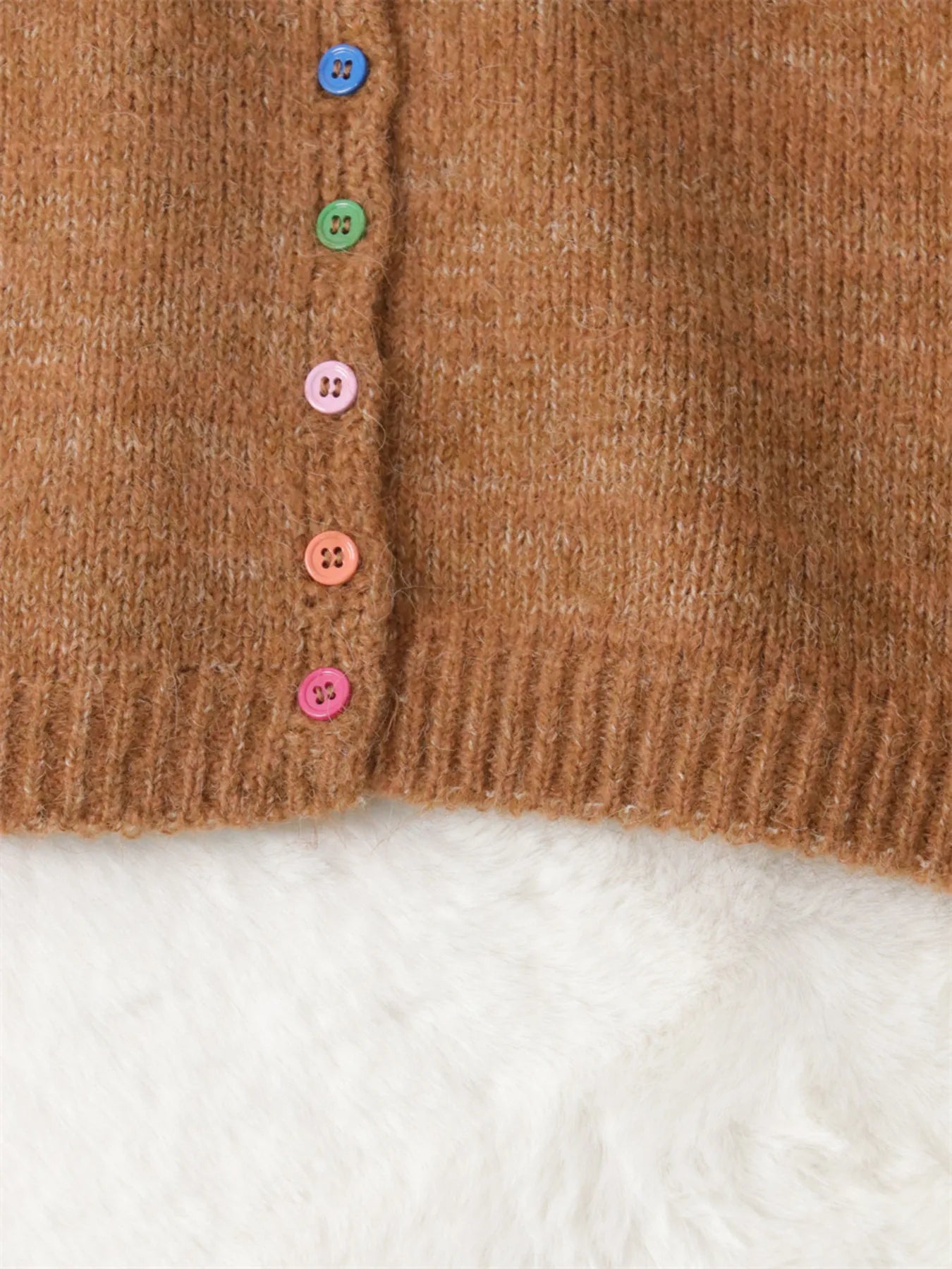 Close-up of brown cardigan button front with multicolor buttons