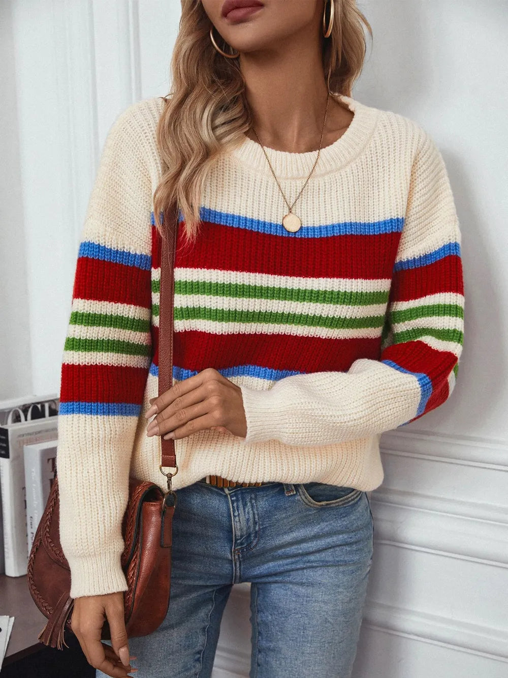 Cream round-neck sweater with wide red, blue, and green stripe bands, long sleeves
