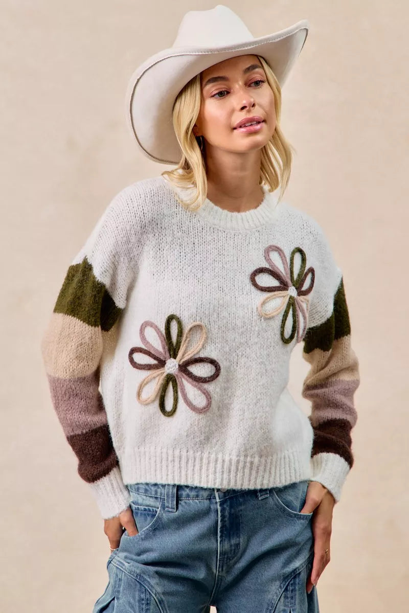 Ivory flower color block sweater with floral embroidery on chest and striped arm bands