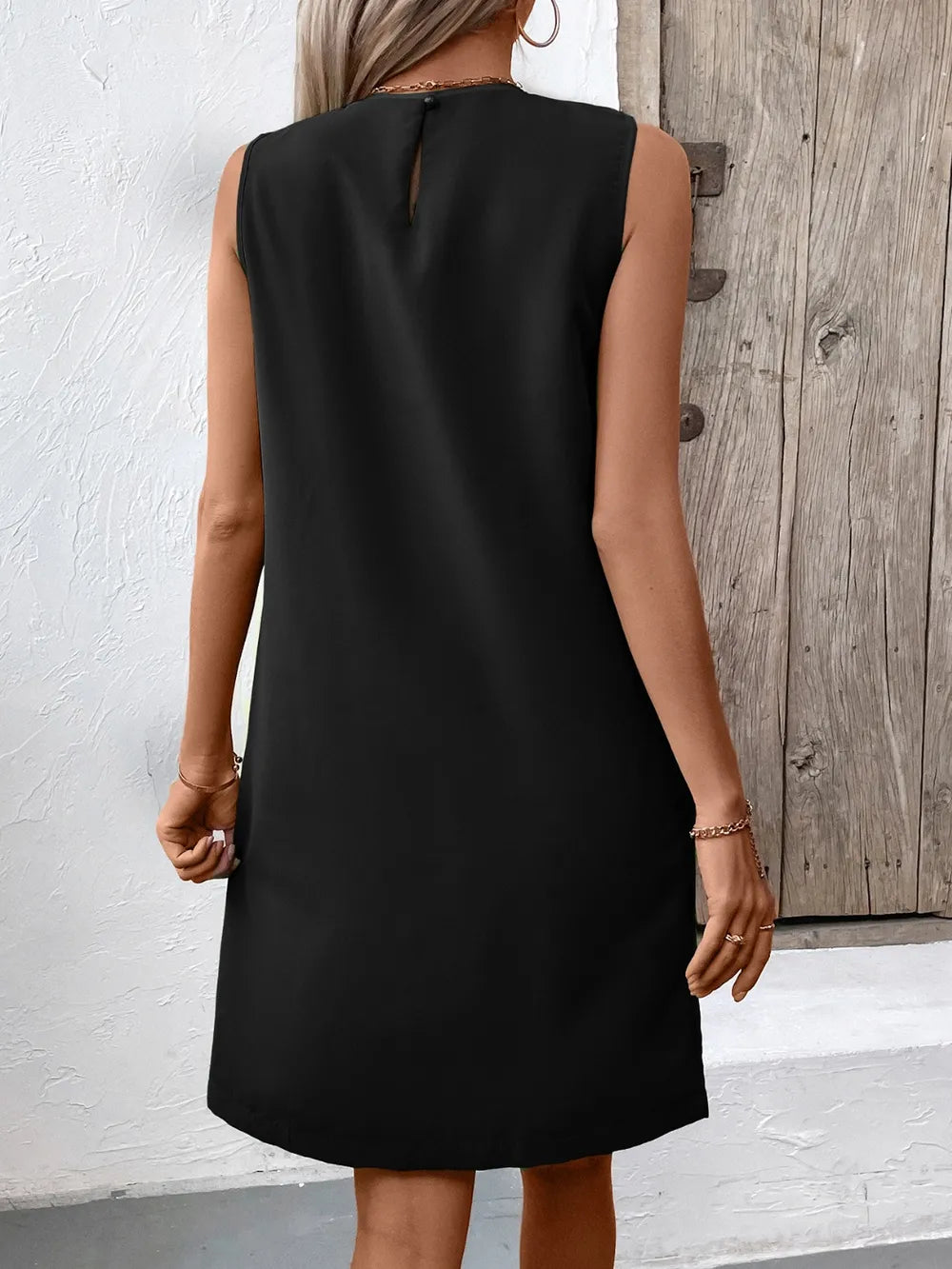 Ivy Lane pocketed round neck sleeveless mini dress in black with back keyhole detail