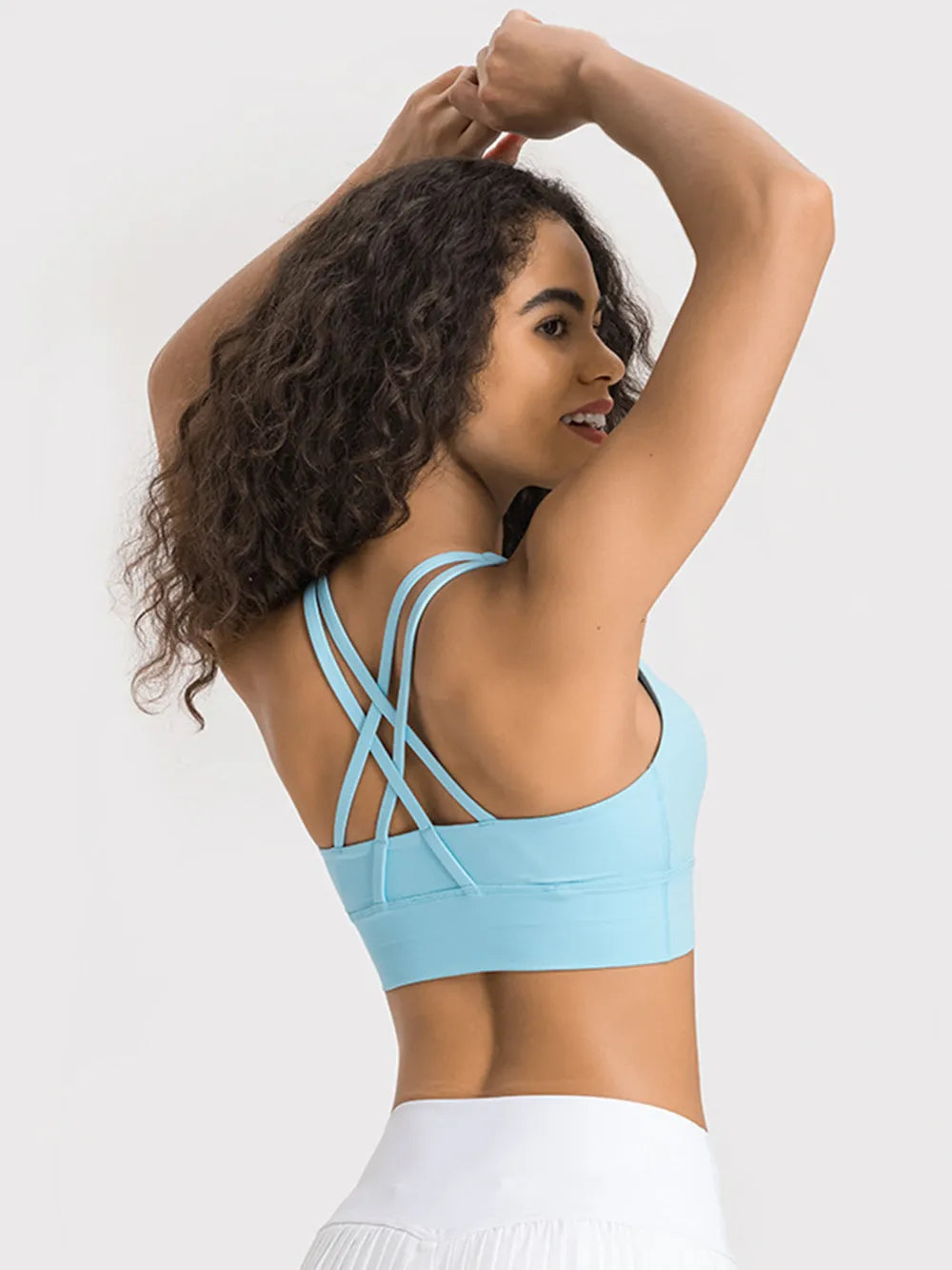 Light blue active tank top with scoop front and crisscross open-back straps