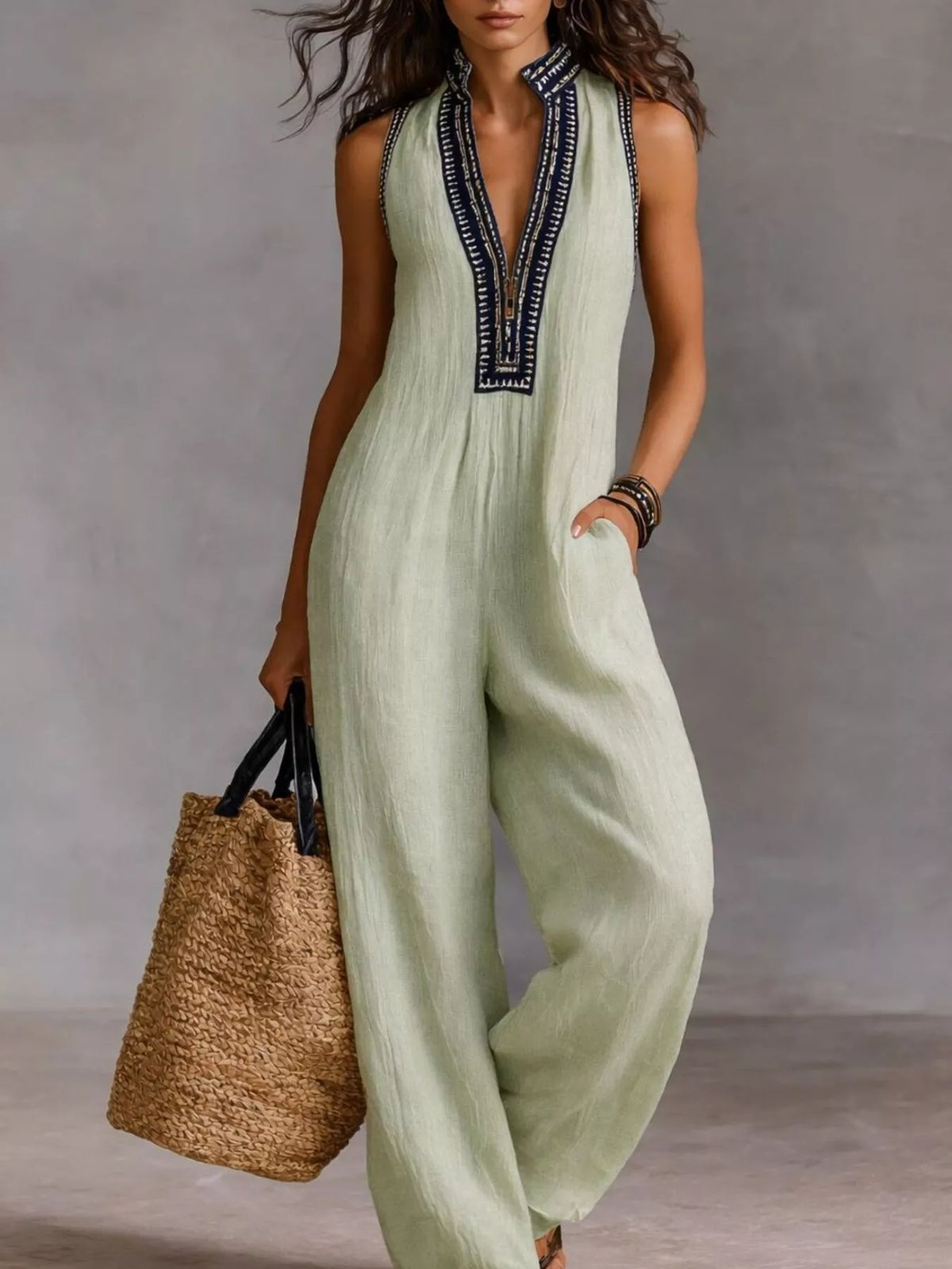 Light green sleeveless wide-leg jumpsuit with V-neck and embroidered front trim