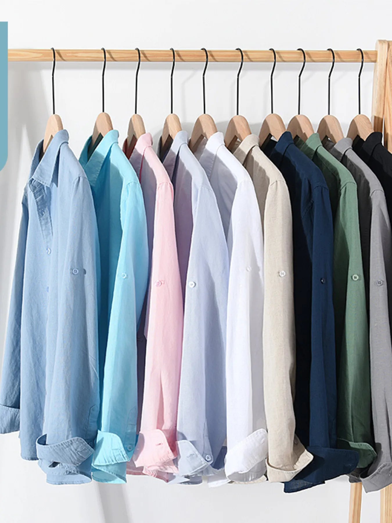 Assorted button-up short sleeve shirts hanging on a rack, mixed colors