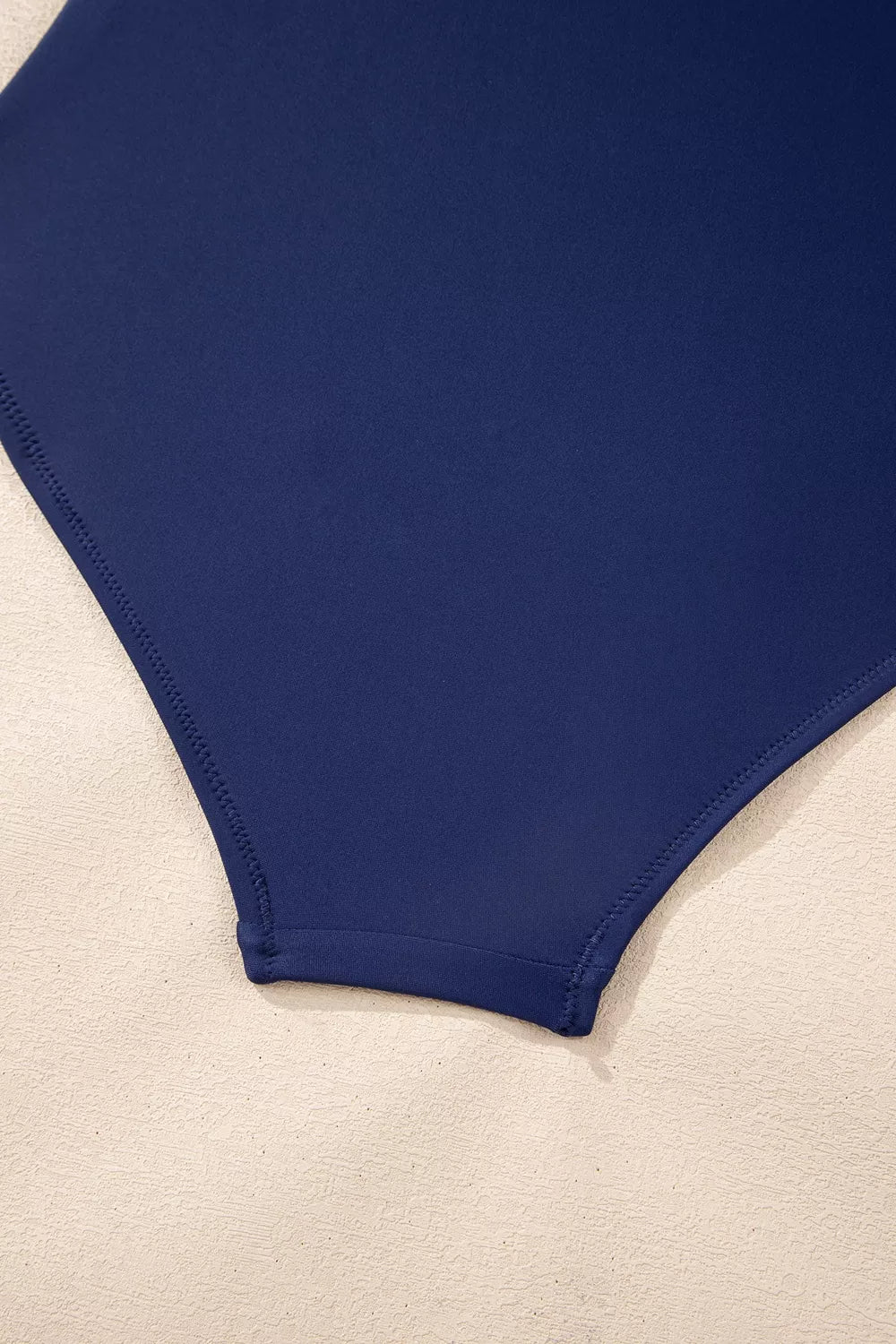 Navy high-cut swimsuit bottom with smooth stitched edges