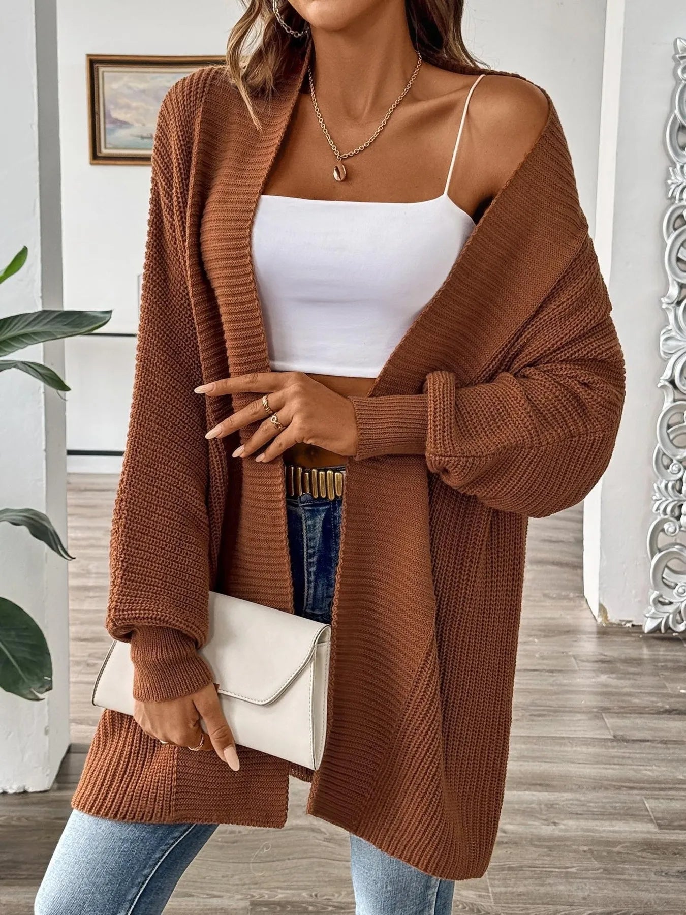 Brown open-front knit cardigan, long sleeves, relaxed oversized fit, hip length