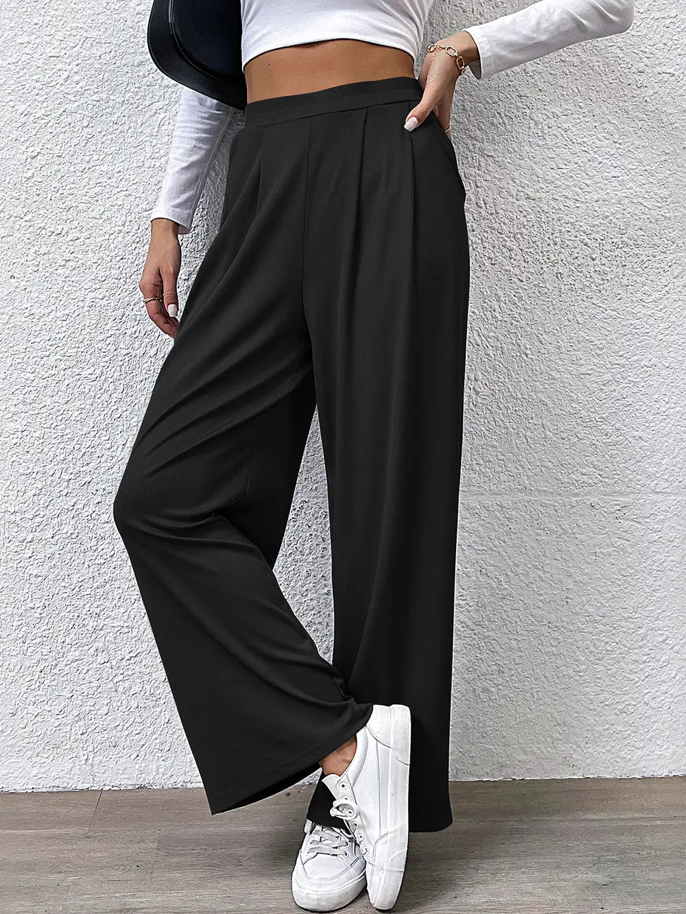 High-waist straight black pants with relaxed drape and wide legs