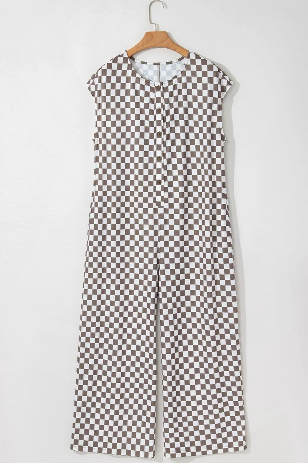 Brown-and-white checkered sleeveless crew neck wide-leg jumpsuit on hanger