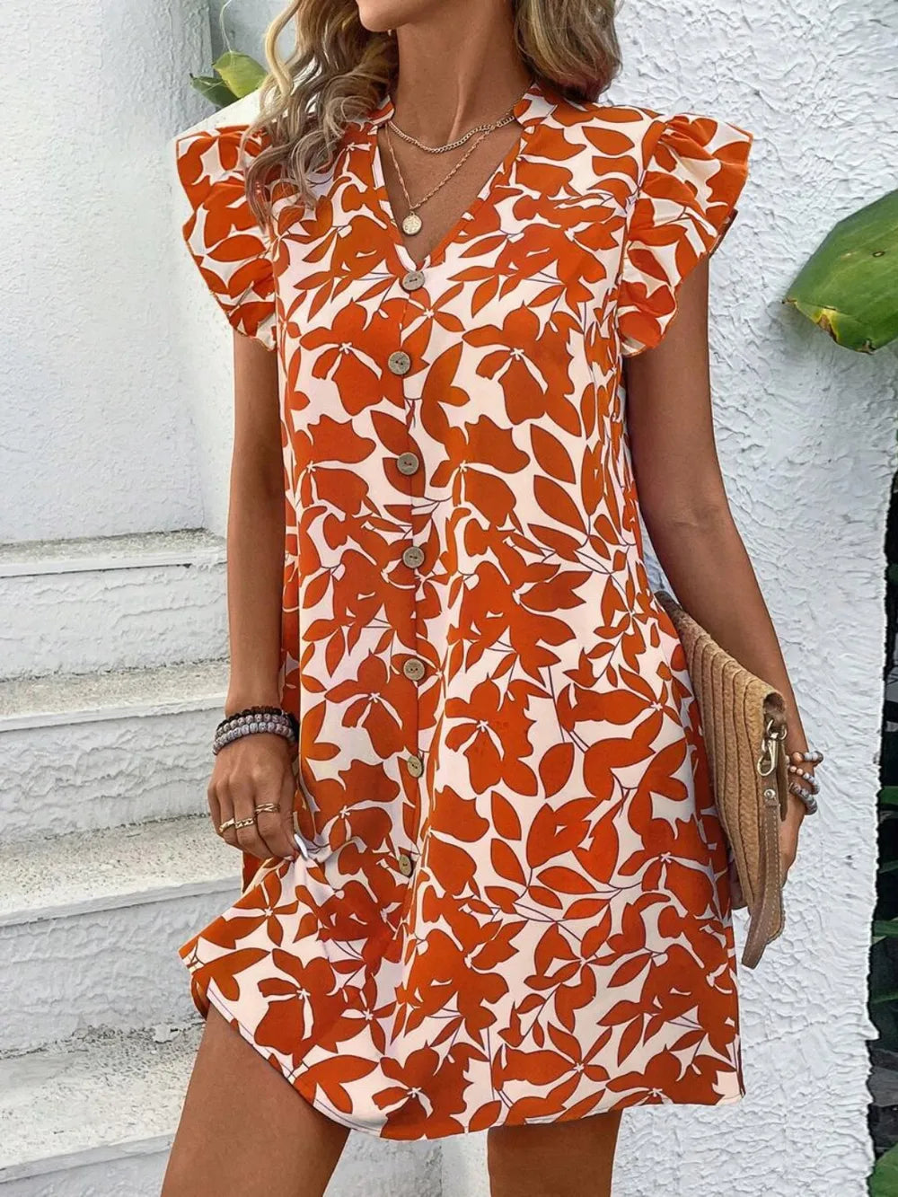 Printed notched cap-sleeve mini dress in orange floral print with decorative buttons down front, Trendsi