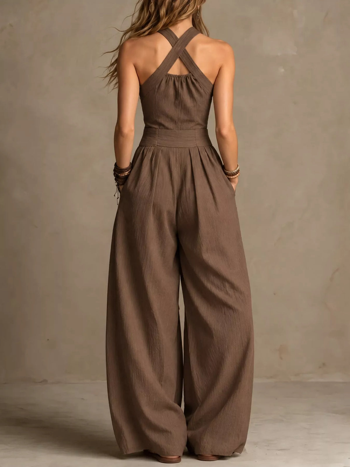 Mocha halter linen jumpsuit, open back crisscross straps, wide-leg silhouette