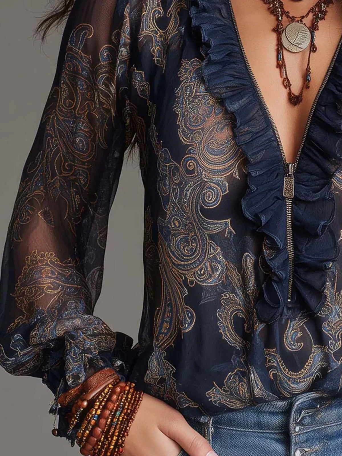 Navy blue paisley ruffle zip-front blouse with long sleeves and ruffled zipper placket