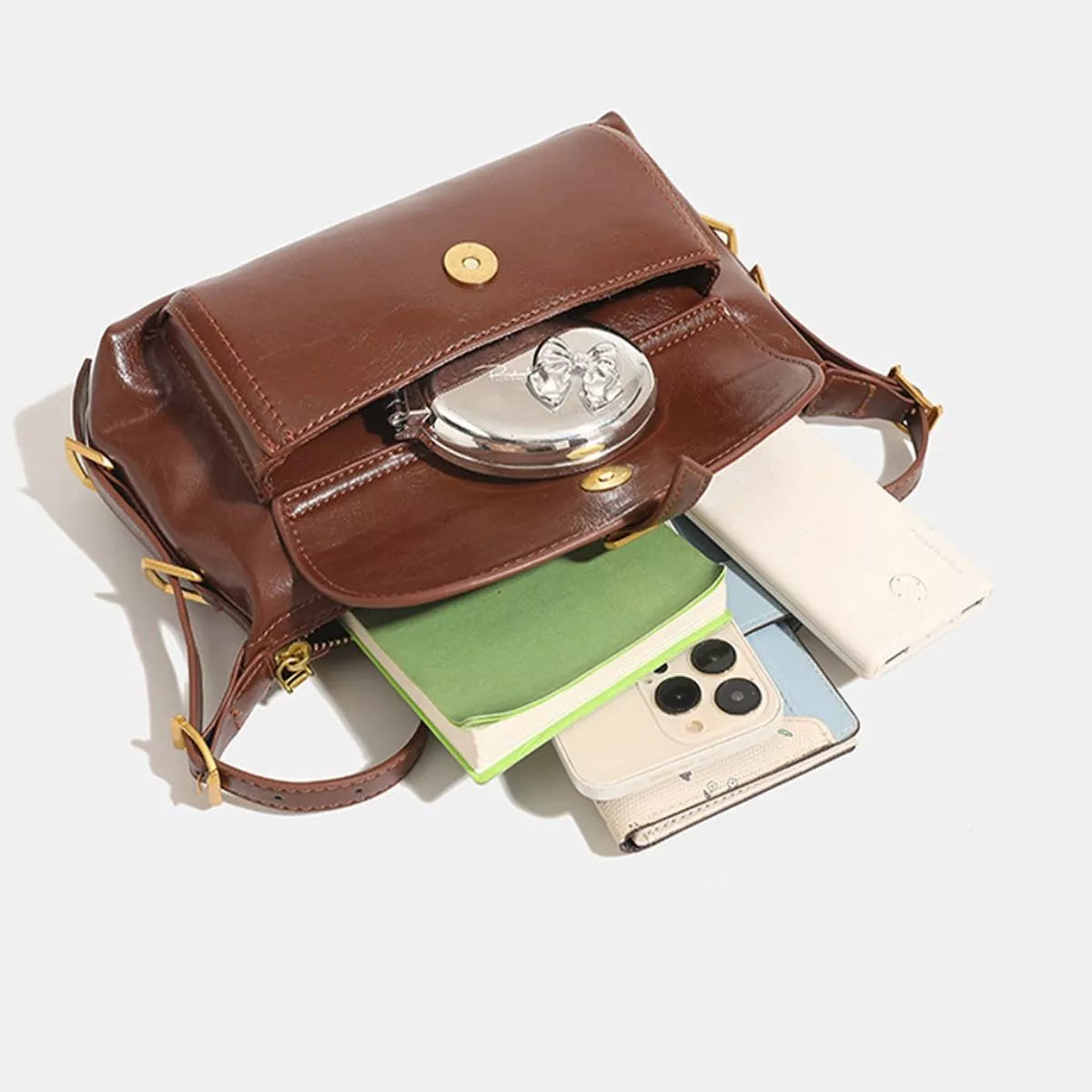 Caramel vegan leather shoulder bag with front flap snap, gold-tone hardware, top opening