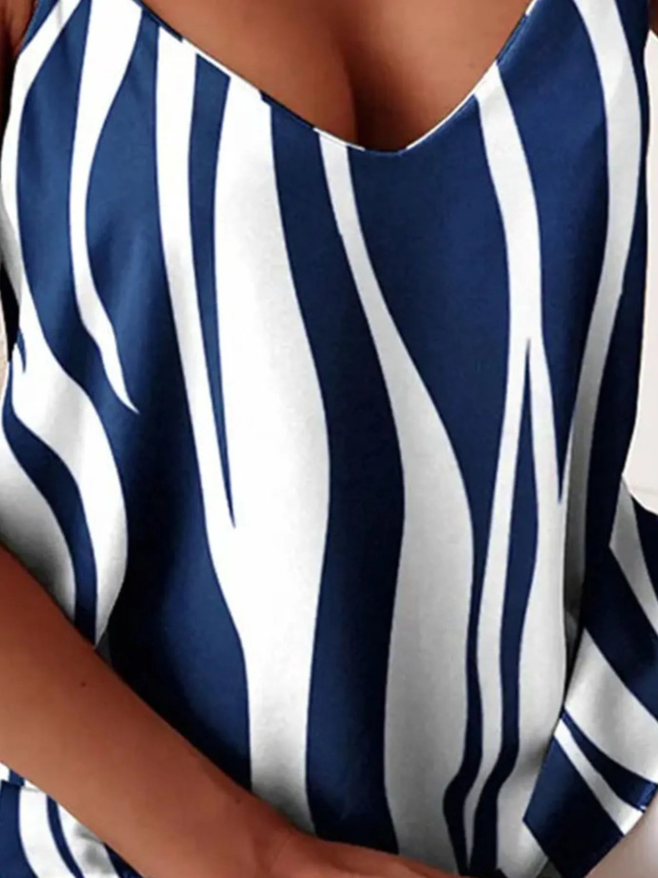 Chain-strap v-neck tank top featuring bold blue-and-white vertical stripes