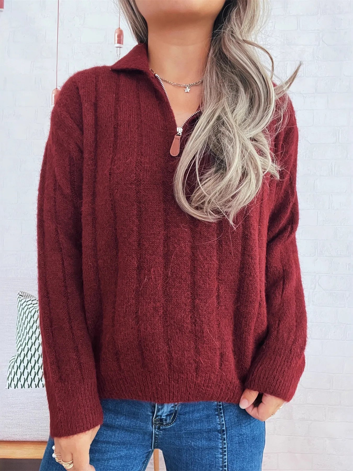 Ribbed hem quarter-zip sweater, burgundy knit with quarter-zip neckline and cuffs.