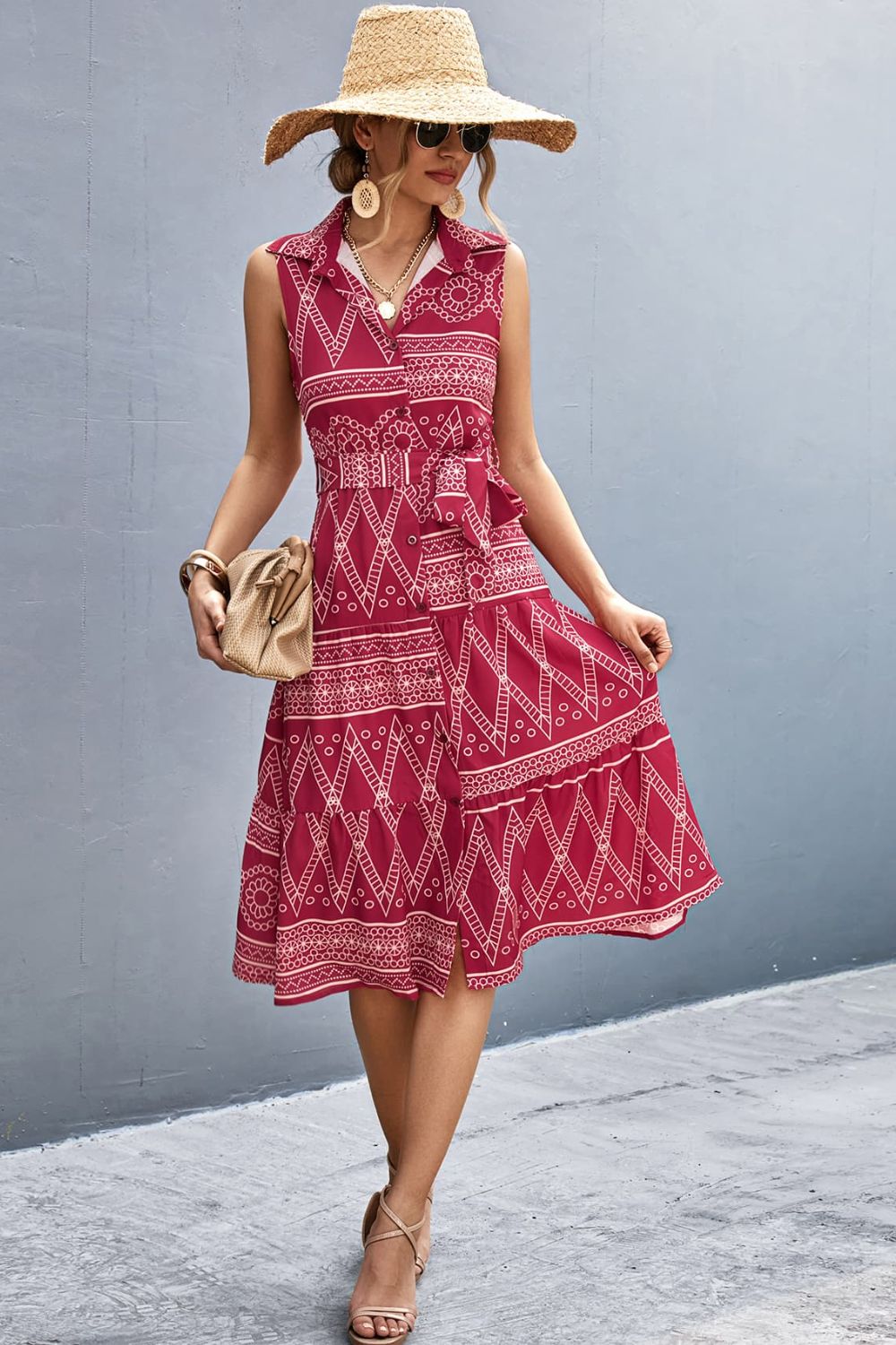 Deep red printed sleeveless collared dress with button-front and tie waist
