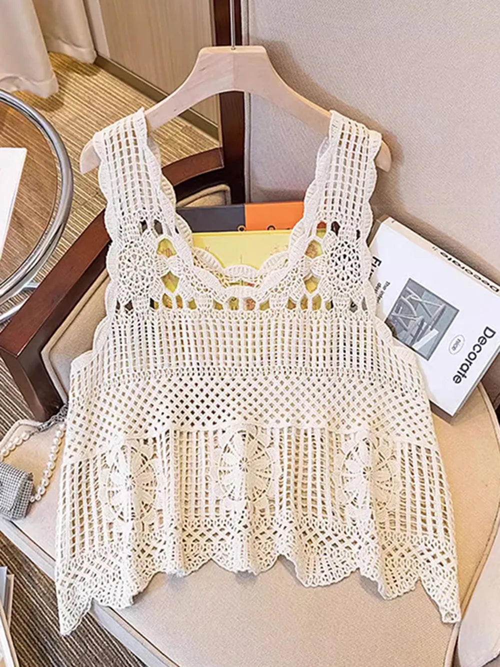 Openwork scoop-neck tank in cream crochet on hanger, wide straps and scalloped edges