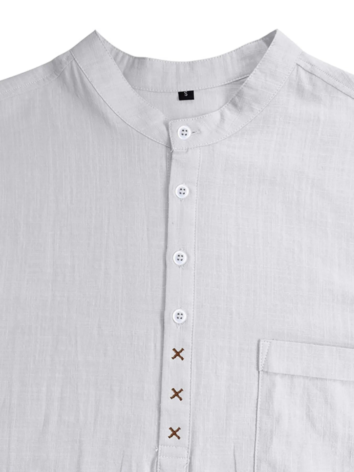 Men's linen polo shirt, light gray; button placket and chest pocket detail close-up.