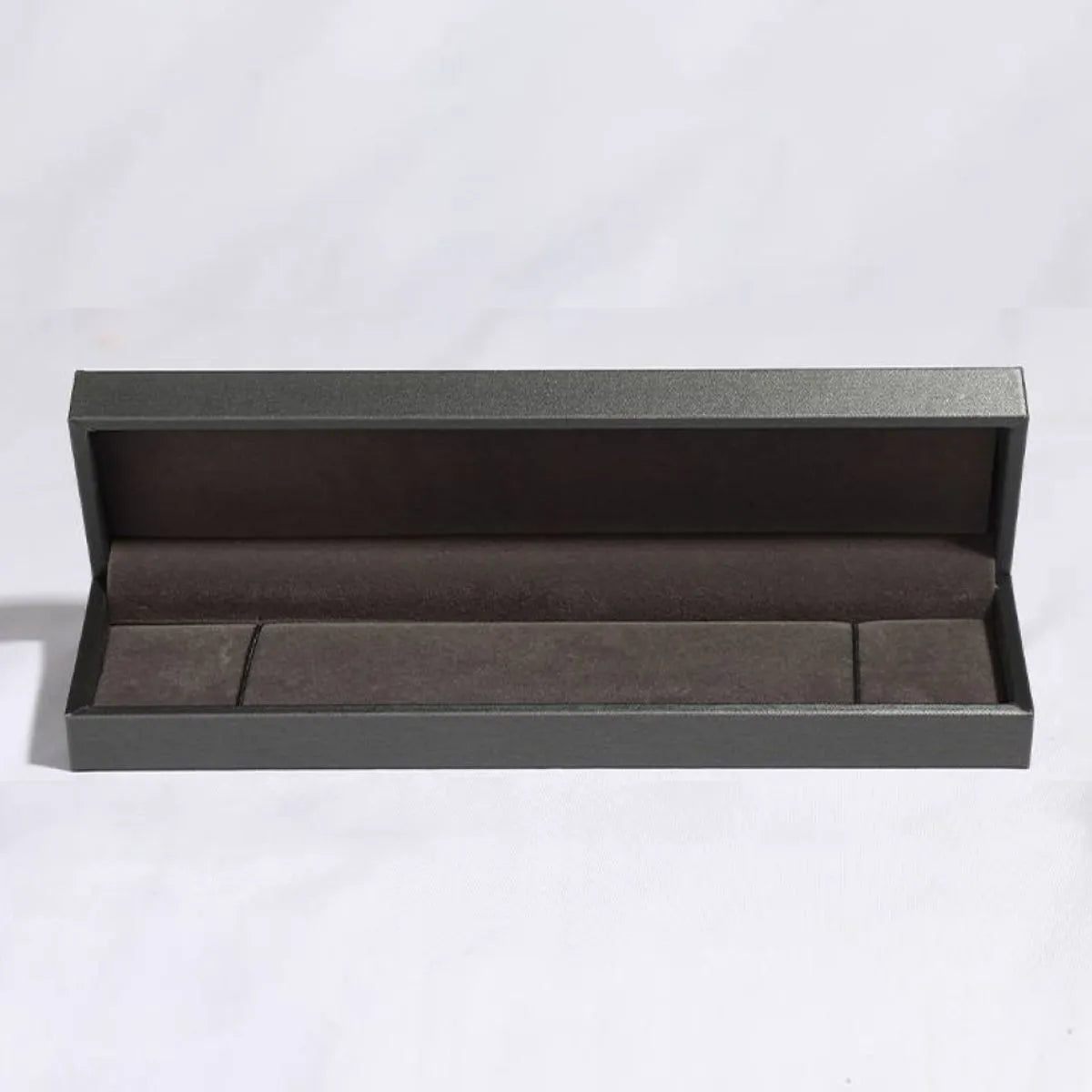 Black and gray jewelry box for a sterling silver bracelet, open insert visible