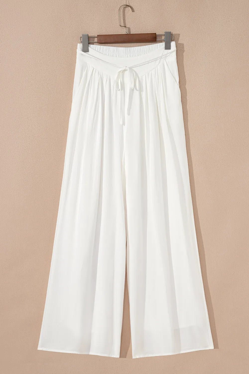 White wide-leg pants on hanger with drawstring elastic waistband