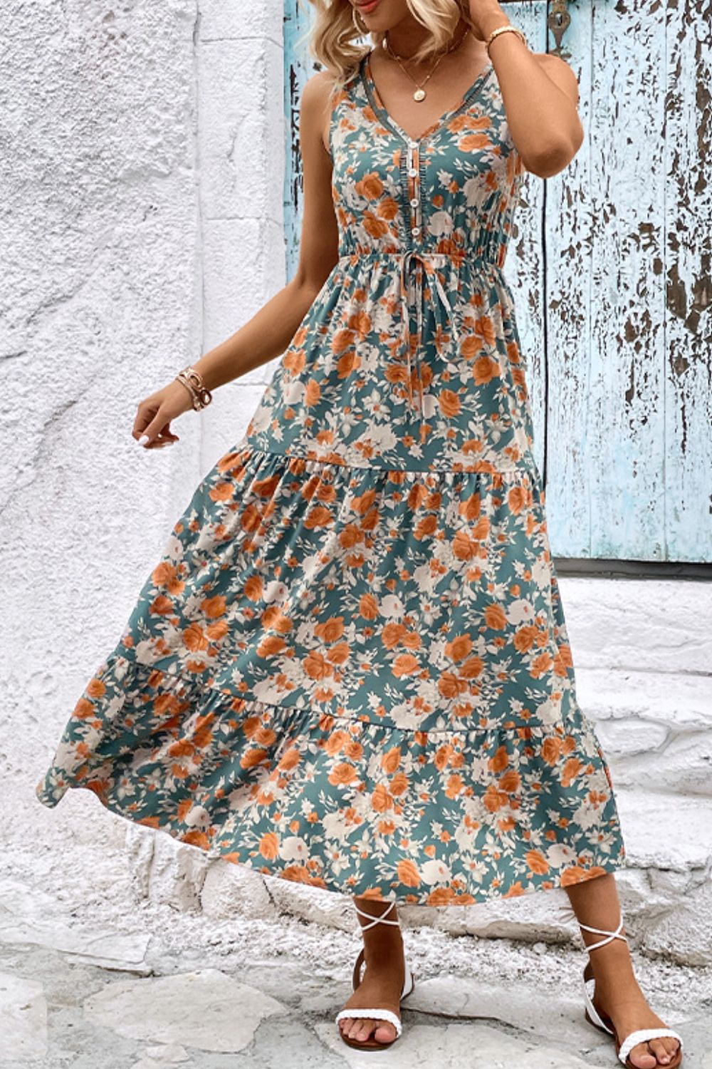 Floral V-neck tiered sleeveless midi dress with gathered bodice, orange and teal.