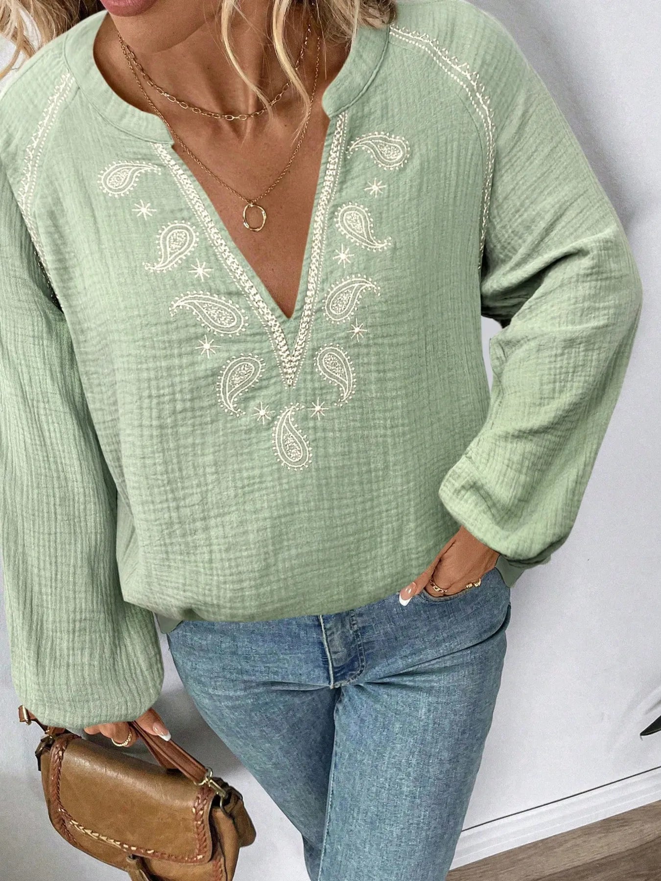 Matcha green long sleeve blouse with paisley embroidery at V-neck and center seam