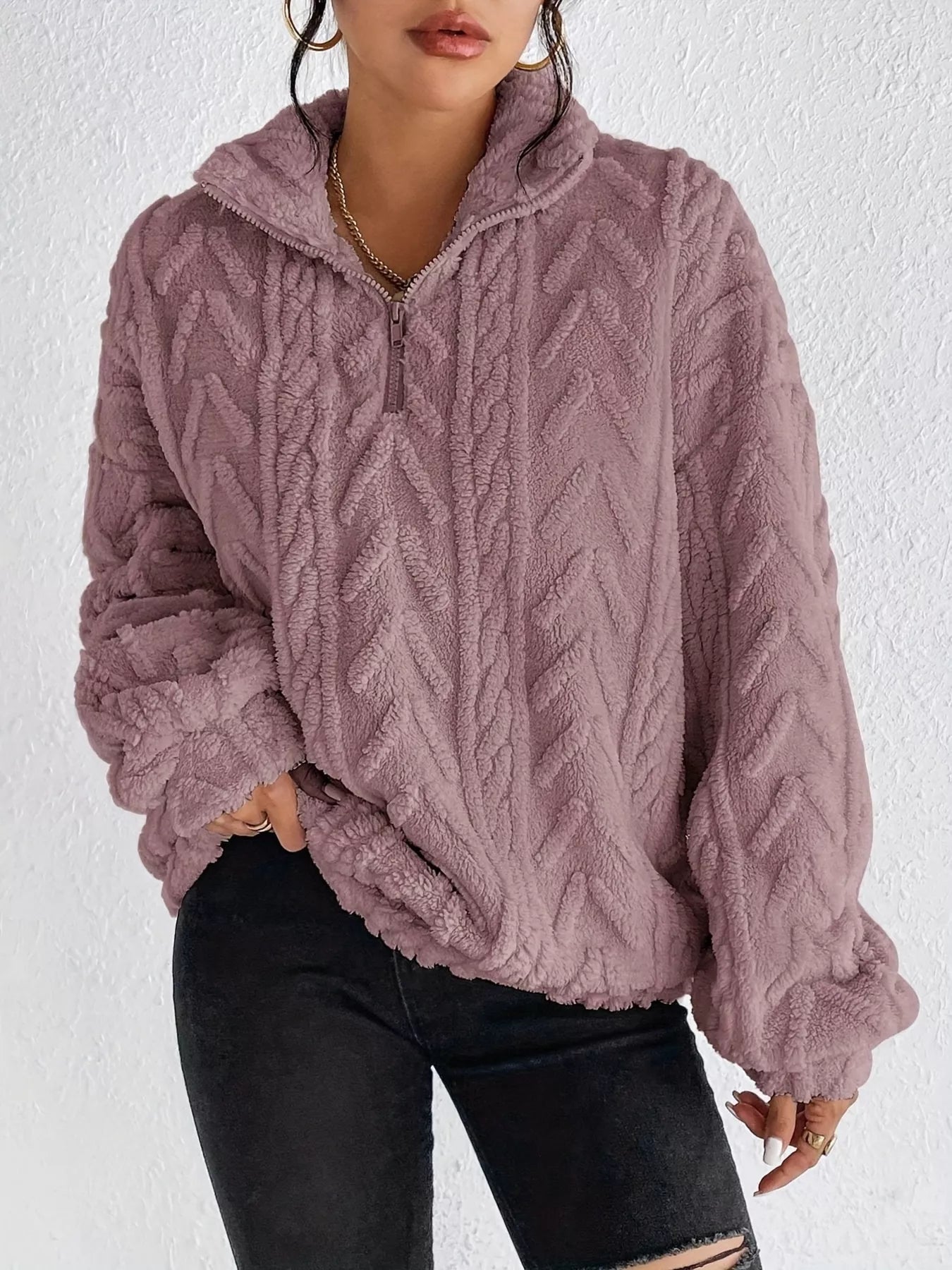 Light purple sherpa quarter-zip sweatshirt with cable knit texture and dropped shoulders