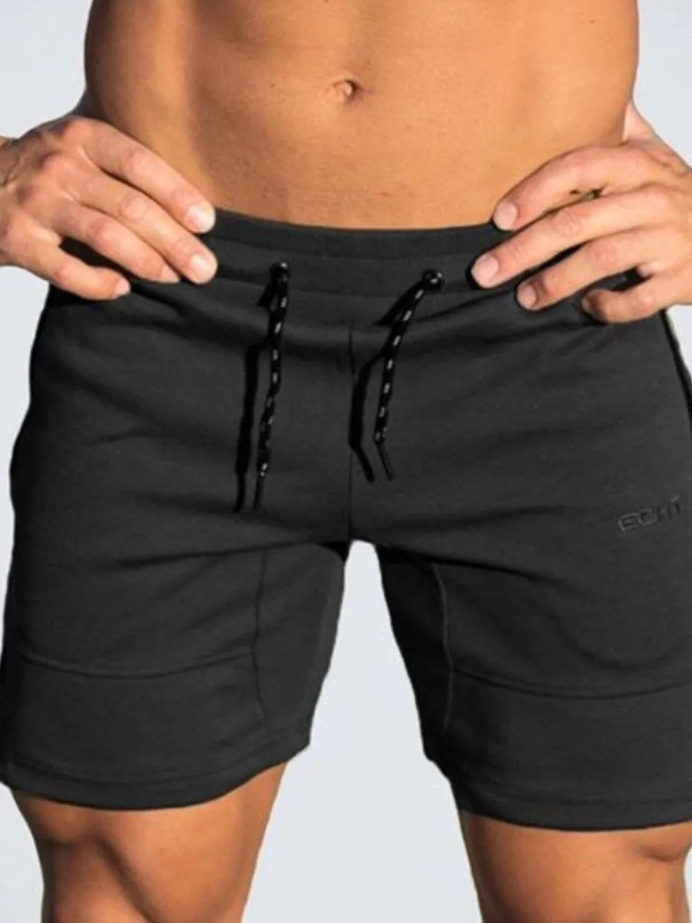 Black drawstring shorts with front tie cords and side pockets