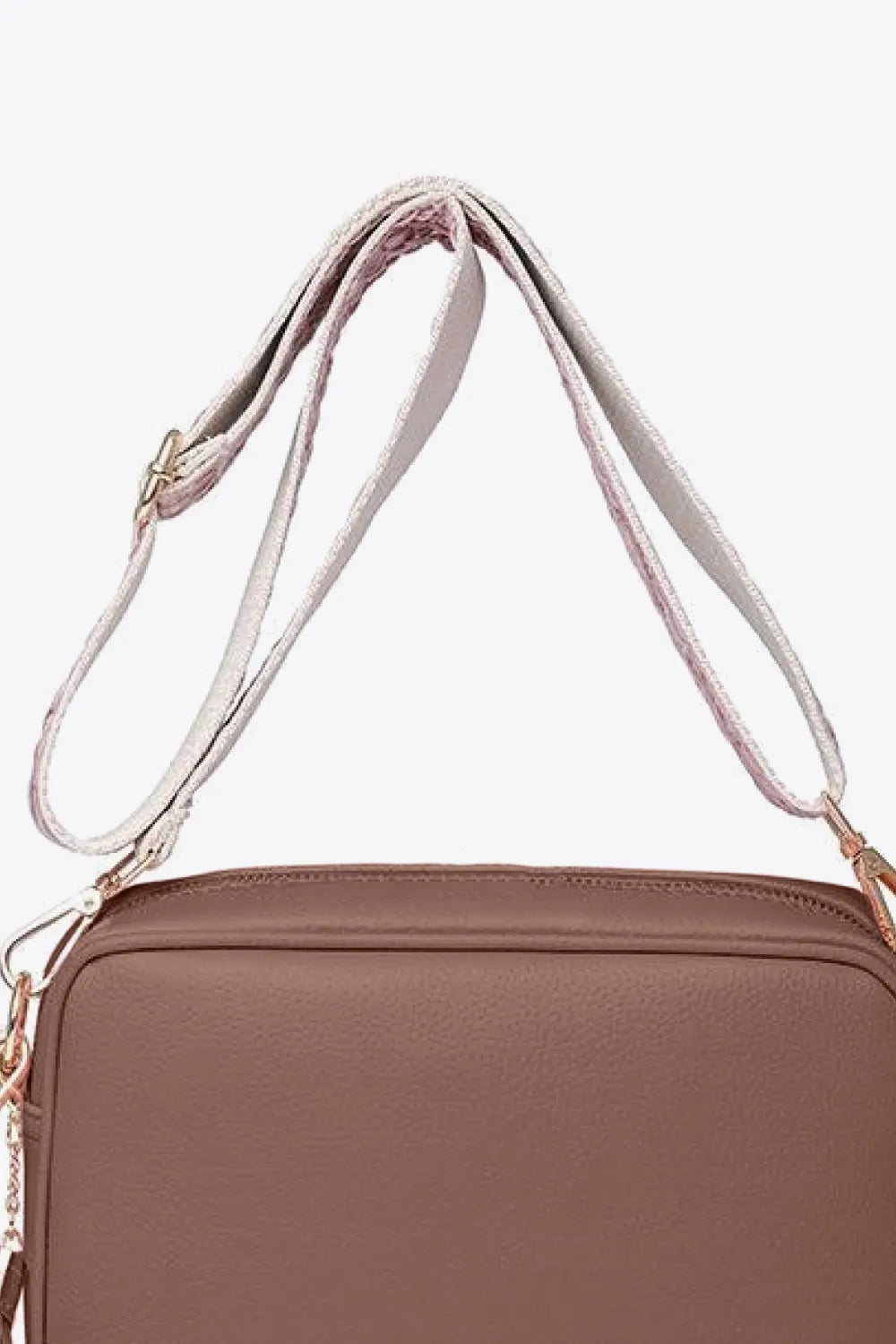 PU leather tassel crossbody bag, mauve-brown front view with zip top and gold-tone rings