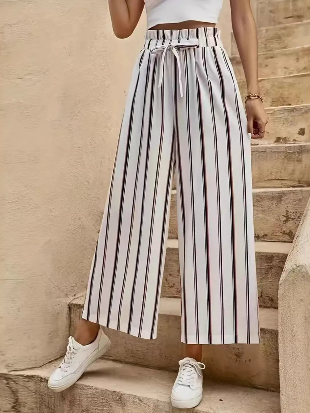 Striped wide-leg pants with elastic waistband and tie, vertical black-and-lavender lines