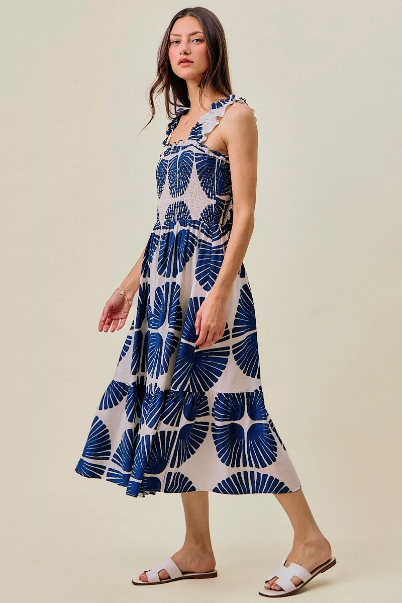Navy and white abstract print tiered midi dress with smocked waist and ruffled straps