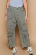 Distressed wide-leg denim pants with raw frayed hem and cargo-style pockets