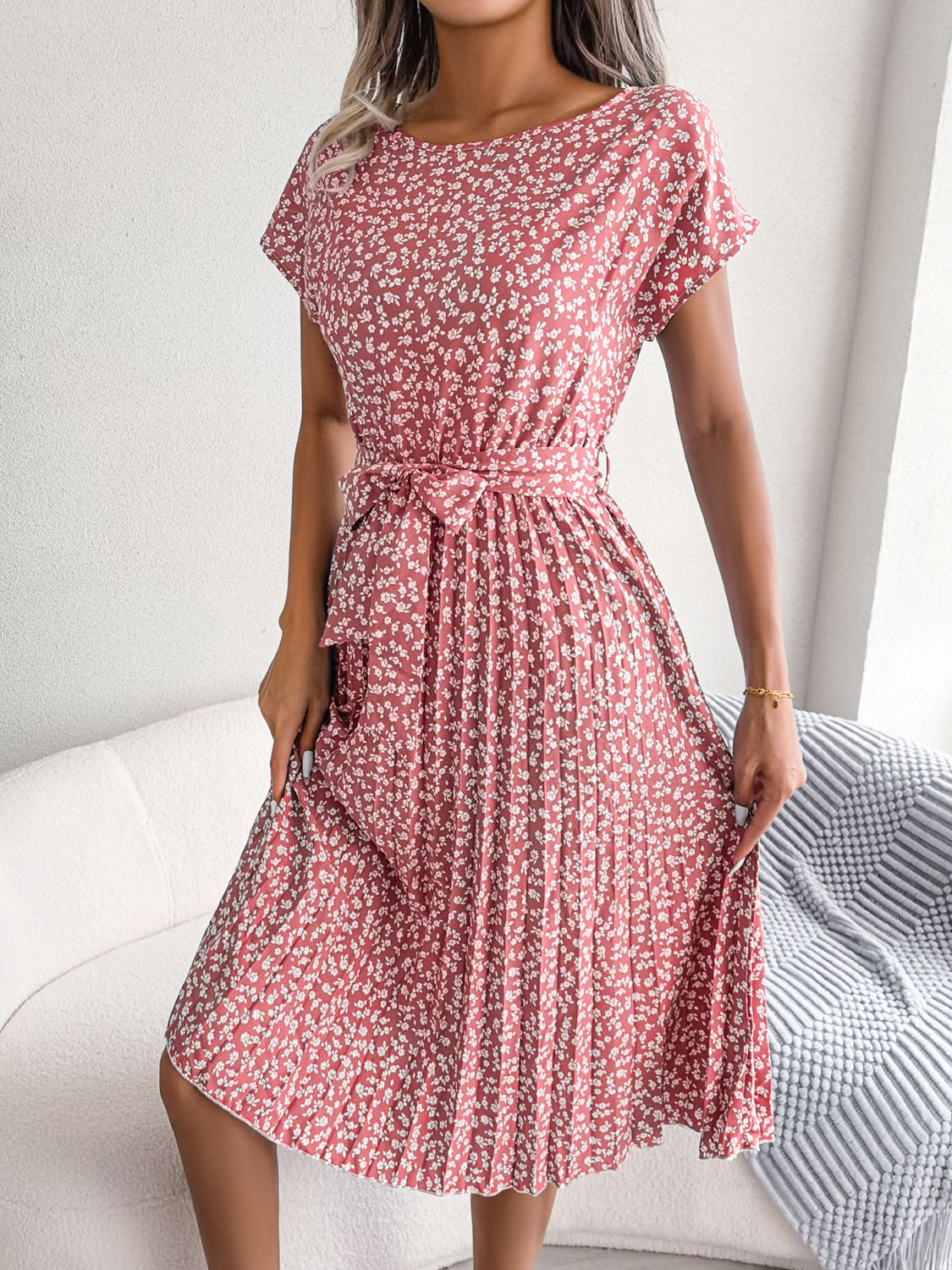 Ditsy floral pleated belted dress in blush pink with tie waist and flared hem