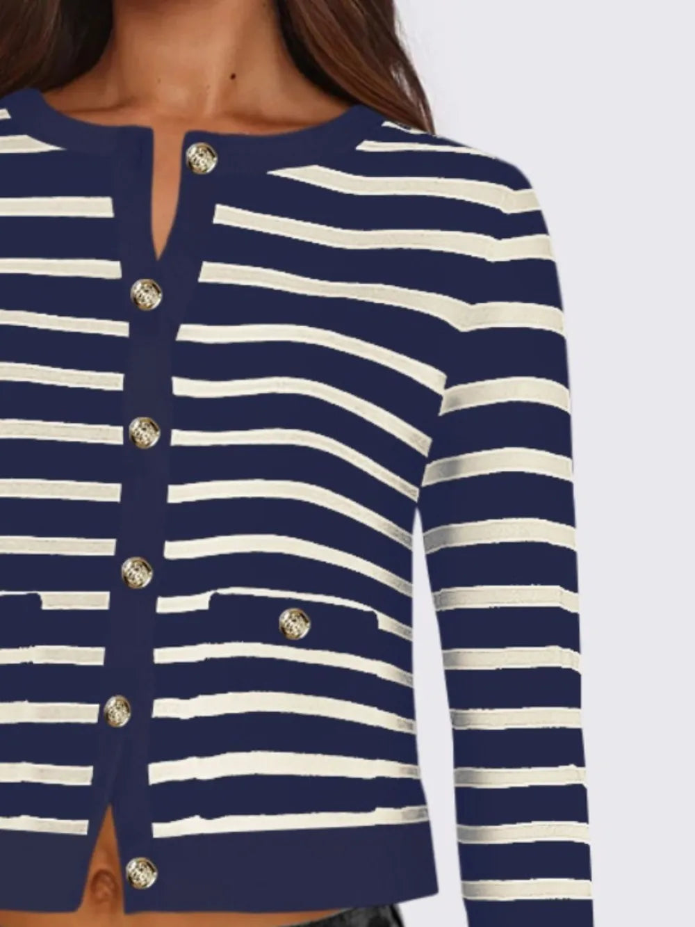Close-up of striped cardigan front buttons and round neckline, navy and white