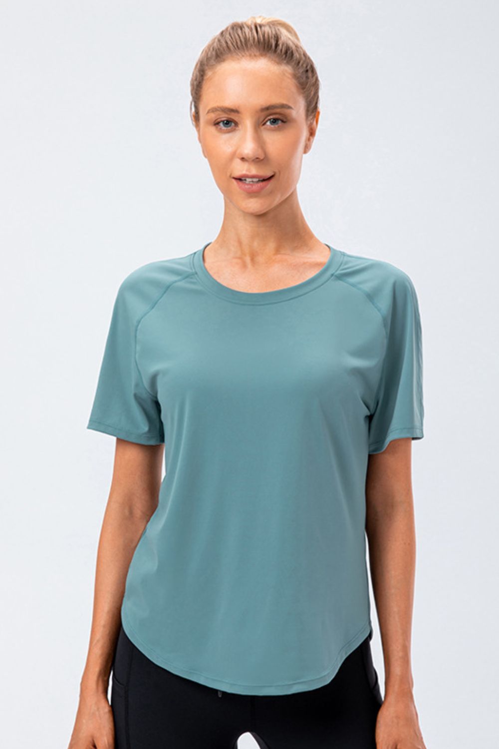 Teal active tee with round neck and raglan sleeves, front view