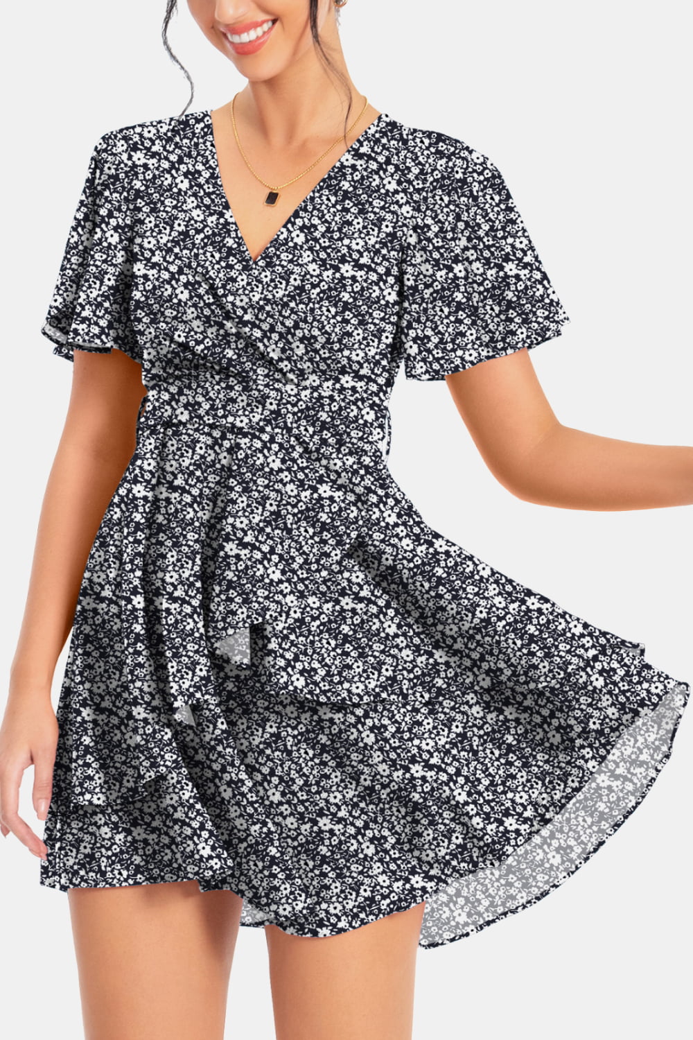 Black floral surplice mini dress with flutter sleeves and flared hem