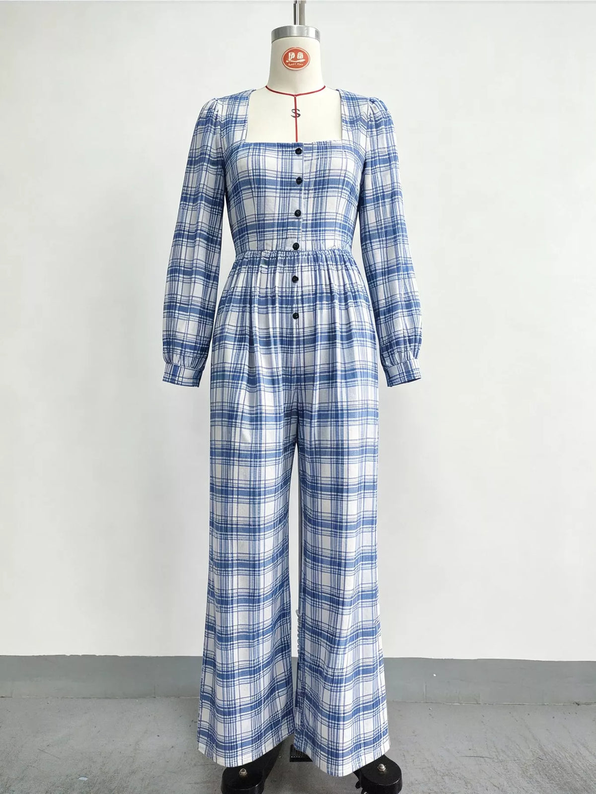 Plaid square-neck long-sleeve jumpsuit with button front and wide legs, light blue