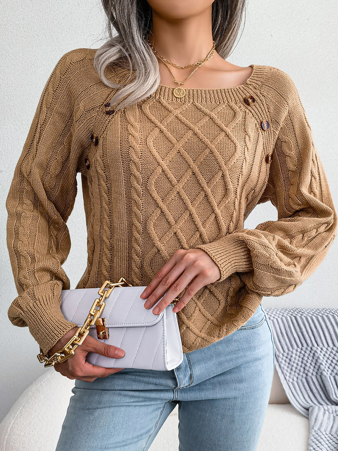 Khaki cable-knit sweater with diamond lattice knit and small button accents