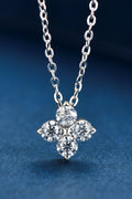 Silver-tone four-leaf clover pendant necklace with four round sparkling stones on a chain