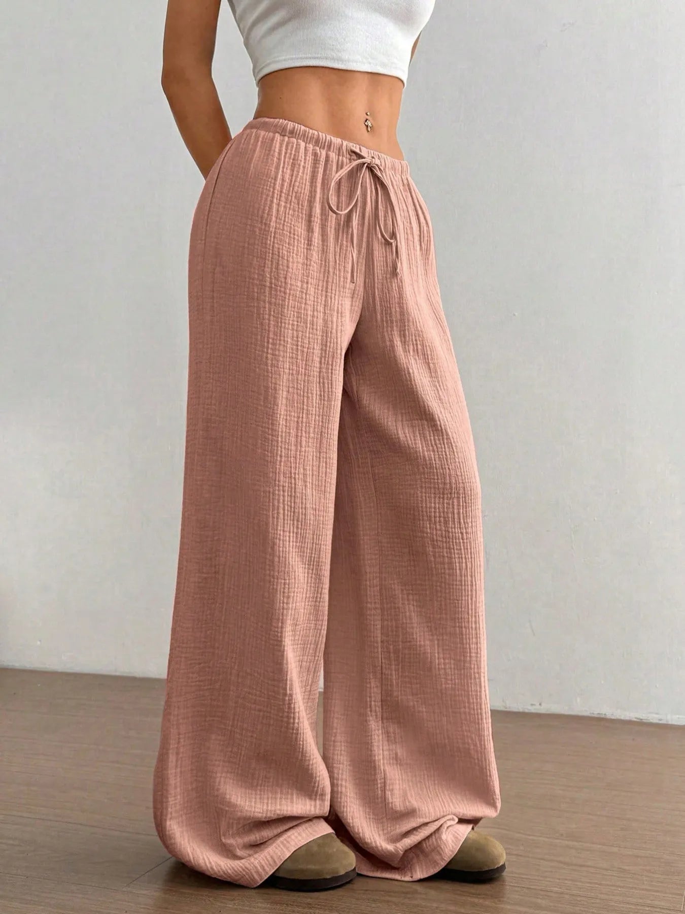 Pink drawstring wide-leg pants with elastic waist and relaxed wide legs