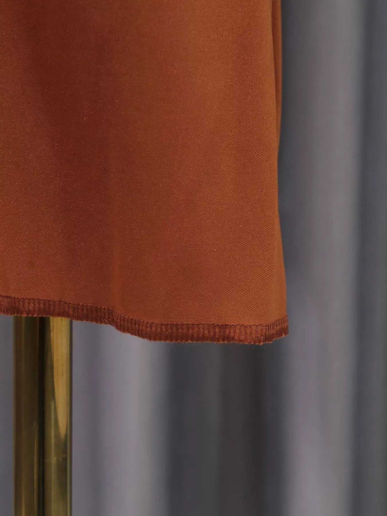 Cedar & Moore Front Twisted Draped Maxi Dress by Trendsi, rust fabric, hem detail