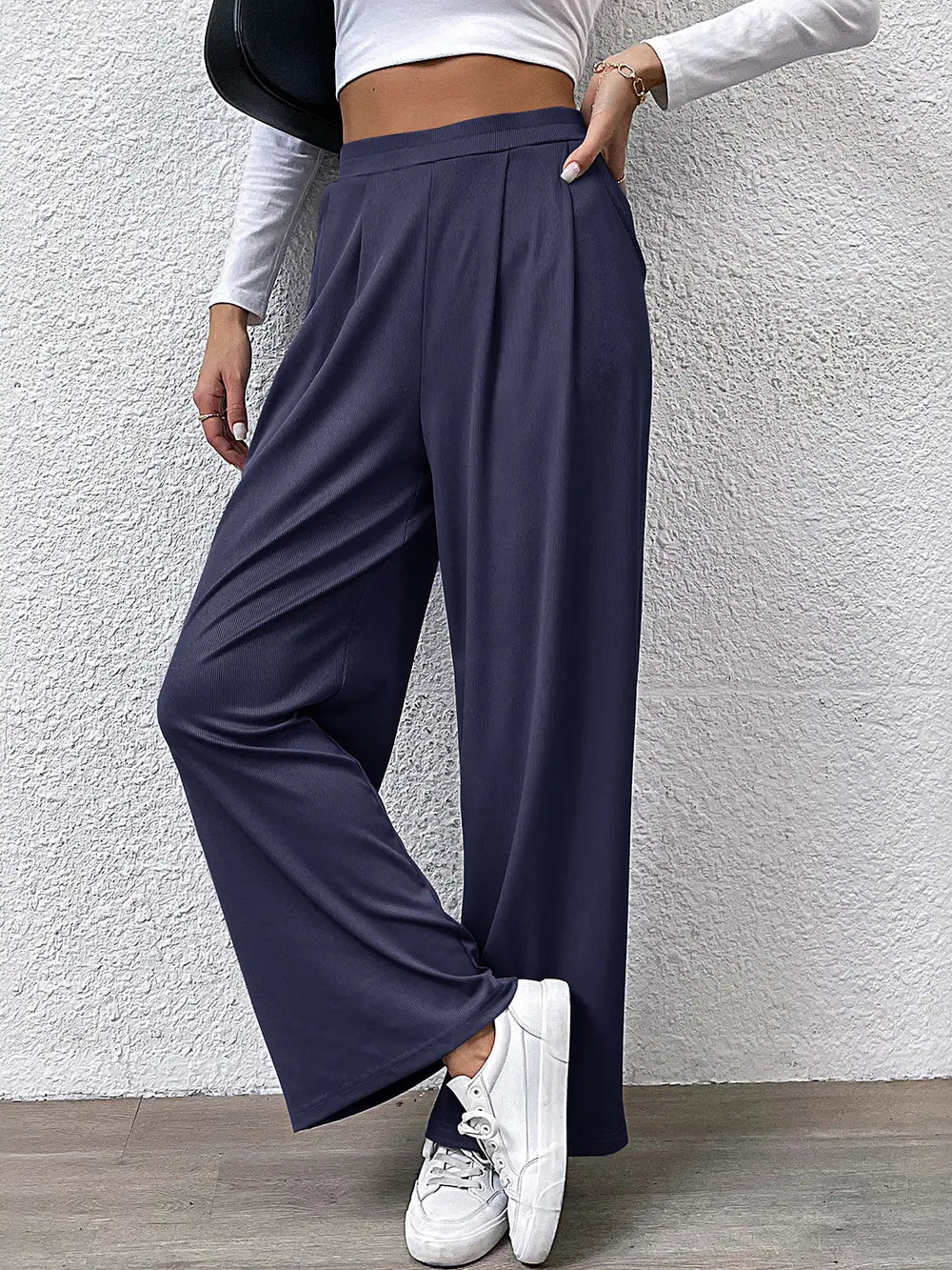 High-waist straight navy pants with pleated front and wide legs