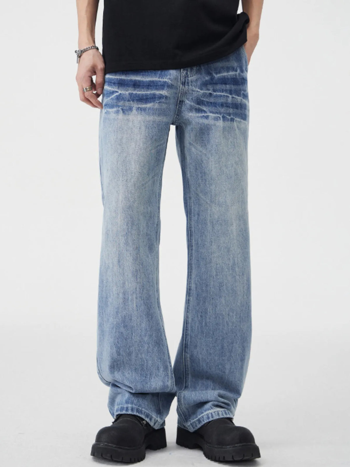 Vintage wash wide-leg cotton jeans in light blue denim with faded detailing and belt loops