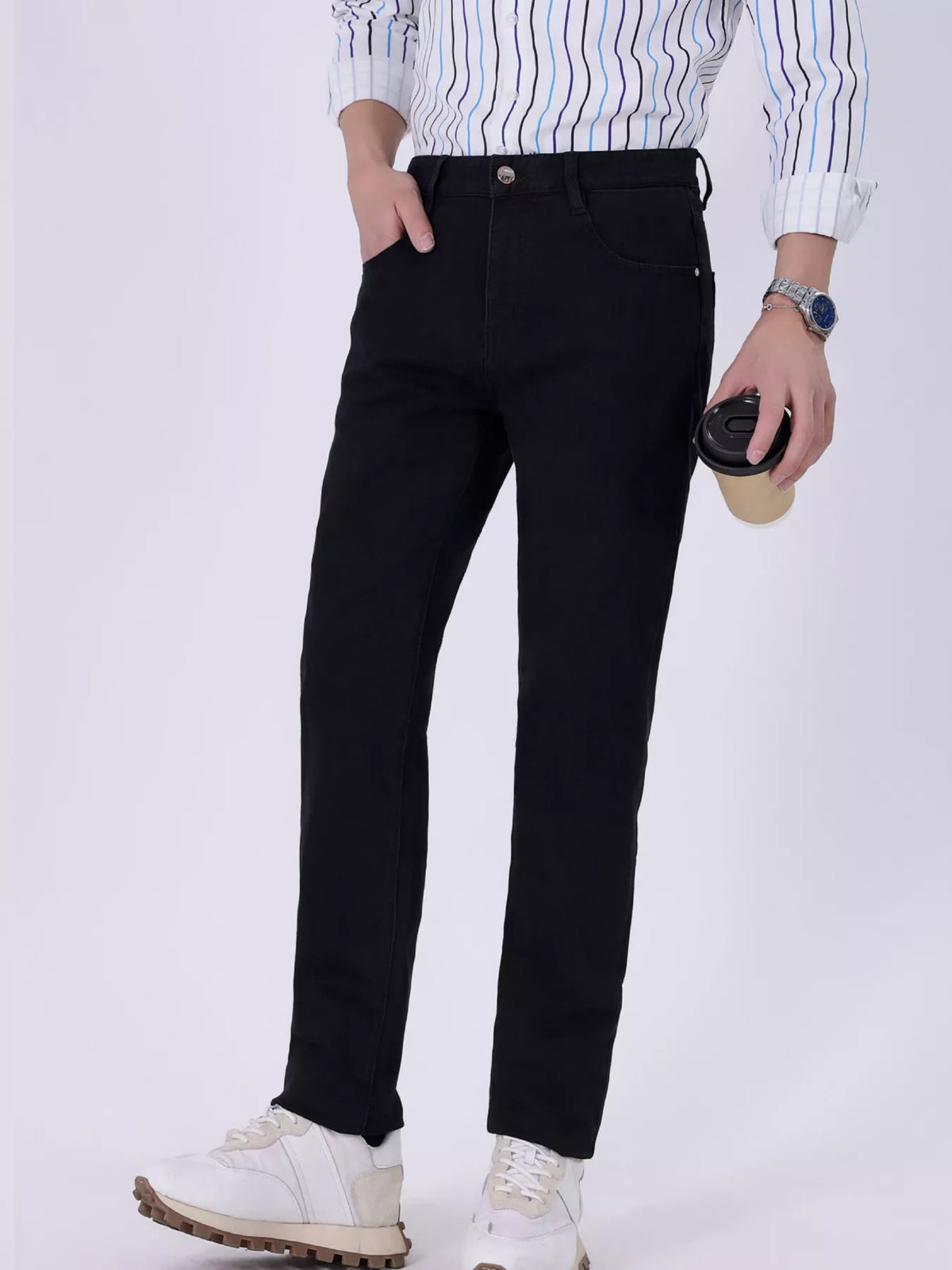 Black slim-fit jeans with button waist, side pockets, and straight-to-tapered legs