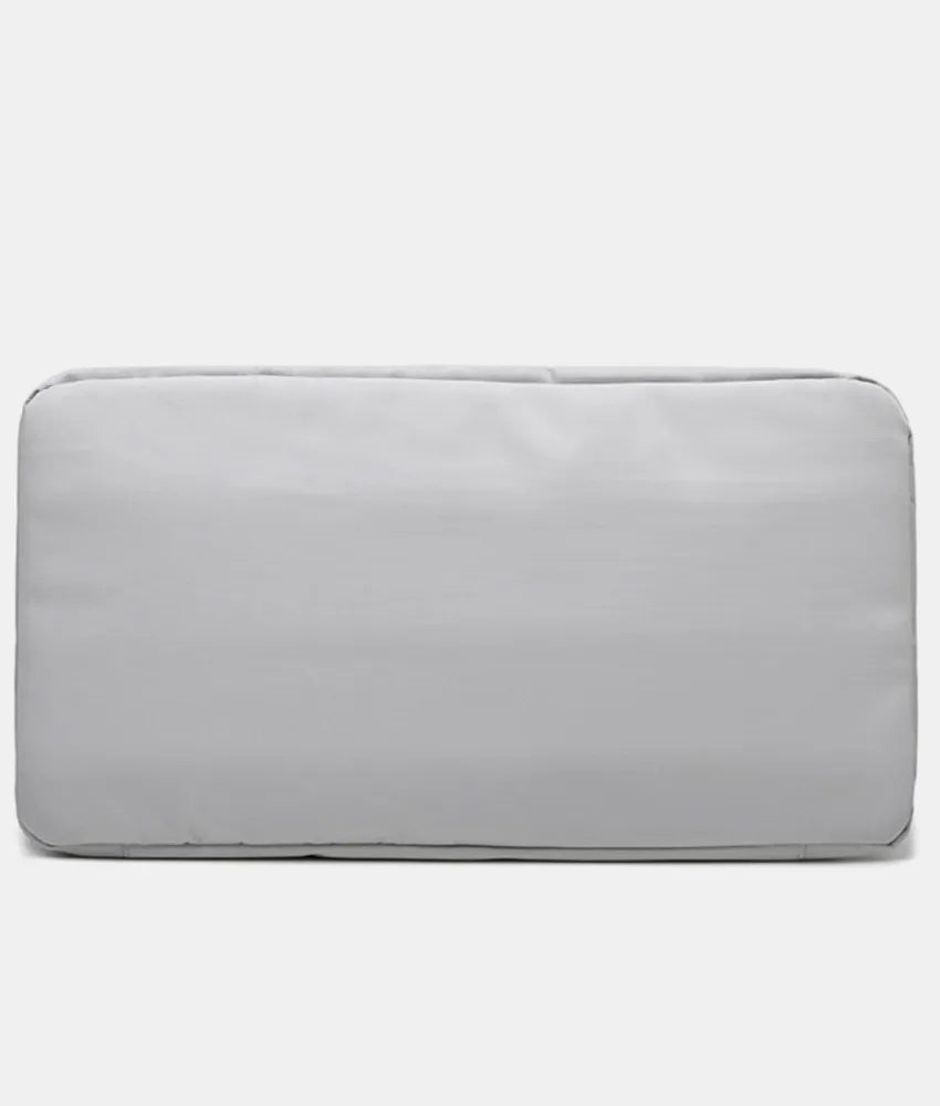 Oversize travel duffle bag with smooth light gray exterior and rounded corners