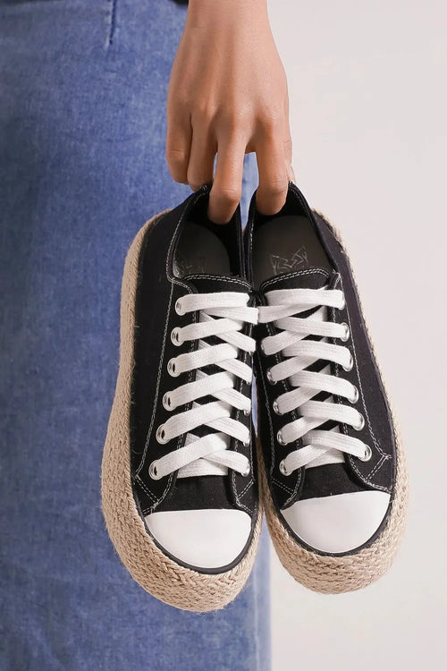 Black lace-up espadrille sole sneakers with white laces and canvas toe cap