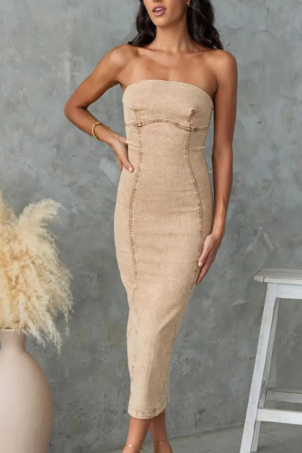 Tan washed denim tube dress with strapless neckline and fitted panel seams