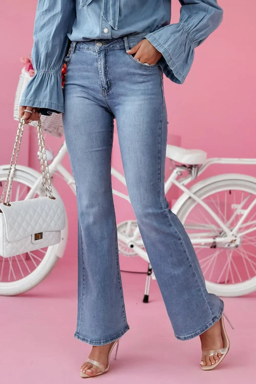 Light blue bootcut jeans with front pockets, button closure, and flared legs